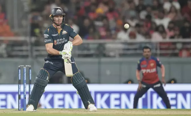 Gujarat Titans' Jos Buttler plays a shot during the Indian Premier League cricket match between Gujarat Titans and Punjab Kings in New Chandigarh, India, Tuesday, March 31, 2026. (AP Photo/Ashwini Bhatia)