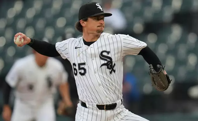 Chicago White Sox starting pitcher Davis Martin (65) throws against the Los Angeles Angels during the first inning of a baseball game Tuesday, April 28, 2026, in Chicago. (AP Photo/Erin Hooley)