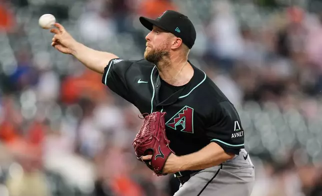 Arizona Diamondbacks starting pitcher Merrill Kelly delivers during the second inning of a baseball game against the Baltimore Orioles, Tuesday, April 14, 2026, in Baltimore. (AP Photo/Stephanie Scarbrough)