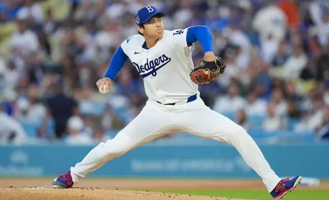 Los Angeles Dodgers starting pitcher Shohei Ohtani throws against the New York Mets during the first inning of a baseball game Wednesday, April 15, 2026, in Los Angeles. (AP Photo/Jae C. Hong)