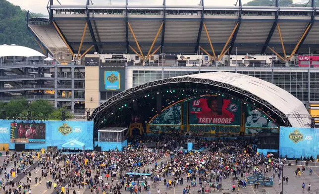 Fans watch at the draft theater during third day of the NFL football draft, Saturday, April 25, 2026, in Pittsburgh. (AP Photo/Gene J. Puskar)