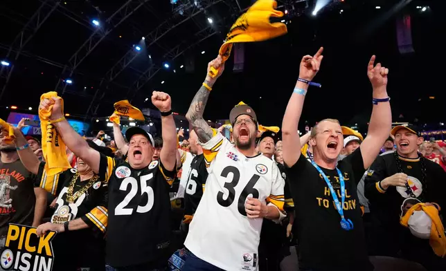 Pittsburgh Steelers fans cheer during the third round of the NFL football draft, Friday, April 24, 2026, in Pittsburgh. (AP Photo/Sue Ogrocki)