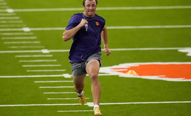 FILE - Clemson quarterback Cade Klubnik runs the 40-yard dash during the school's NFL football pro day, Thursday, March 12, 2026, in Clemson, S.C.. (AP Photo/Mike Stewart, File)
