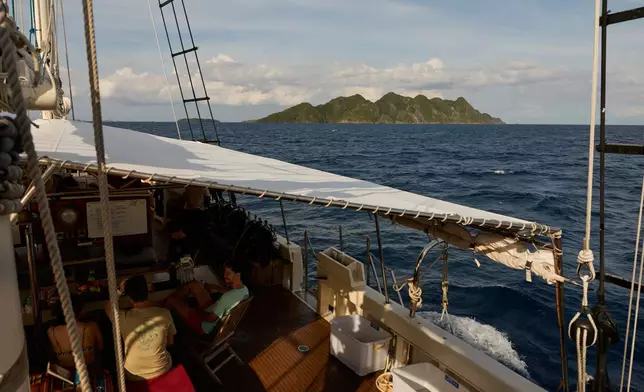 Misool Island is visible from the Raja Laut dive boat in Raja Ampat, Indonesia, Sunday, March 1, 2026. (AP Photo/Claudia Rosel)