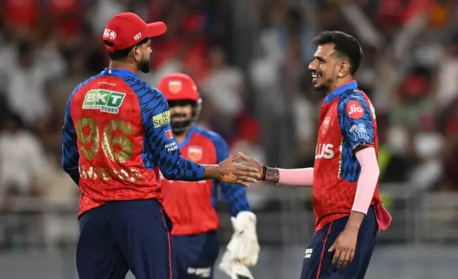 Punjab Kings' Yuzvendra Chahal, right, and Punjab Kings' captain Shreyas Iyer celebrates the wicket of Rajasthan Royals' Dhruv Jurel during the Indian Premier League cricket match between Rajasthan Royals and Punjab Kings in New Chandigarh, India, Tuesday, April 28, 2026.(AP Photo)