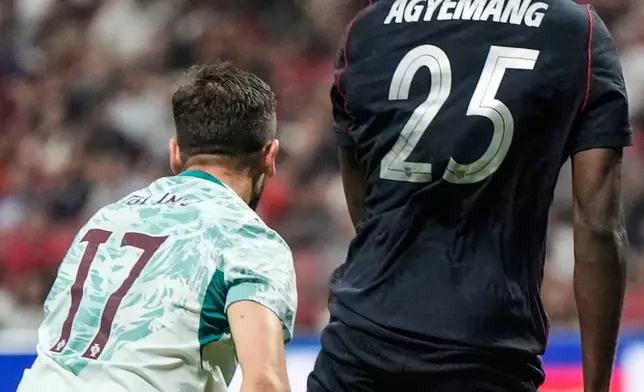 USA's Patrick Agyemang (25) works against Portugal's Paulinho (17) during the second half of an international friendly soccer match, Tuesday, March 31, 2026, in Atlanta. (AP Photo/Mike Stewart)