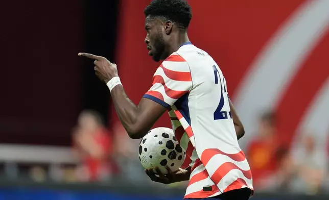 United States' Patrick Agyemang (25) celebrates his goal against Belgium during the second half of an international friendly soccer match, Saturday, March 28, 2026, in Atlanta. (AP Photo/Mike Stewart)