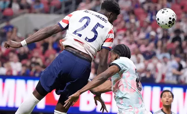 United States' Patrick Agyemang (25) heads the ball toat goal against Belgium during the second half of an international friendly soccer match, Saturday, March 28, 2026, in Atlanta. (AP Photo/Mike Stewart)