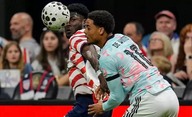 United States' Patrick Agyemang (25) and Belgium's Koni De Winter (16) battle for the ball during the second half of an international friendly soccer match, Saturday, March 28, 2026, in Atlanta. (AP Photo/Mike Stewart)