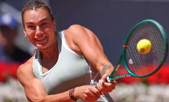 Aryna Sabalenka of Belarus returns the ball to Naomi Osaka of Japan during the Madrid Open tennis tournament in Madrid, Monday, April 27, 2026. (AP Photo/Manu Fernandez)