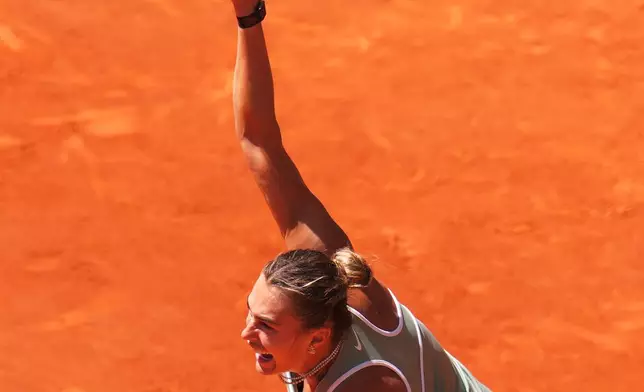 Aryna Sabalenka of Belarus returns the ball to Naomi Osaka of Japan during the Madrid Open tennis tournament in Madrid, Monday, April 27, 2026. (AP Photo/Manu Fernandez)
