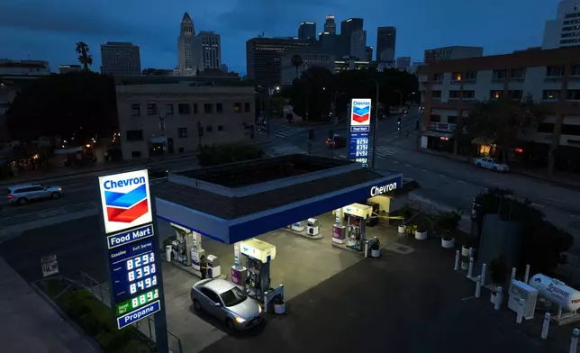 Gas prices are displayed at a Chevron gas station, in downtown Los Angeles, Tuesday, March 31, 2026. (AP Photo/Jae C. Hong)