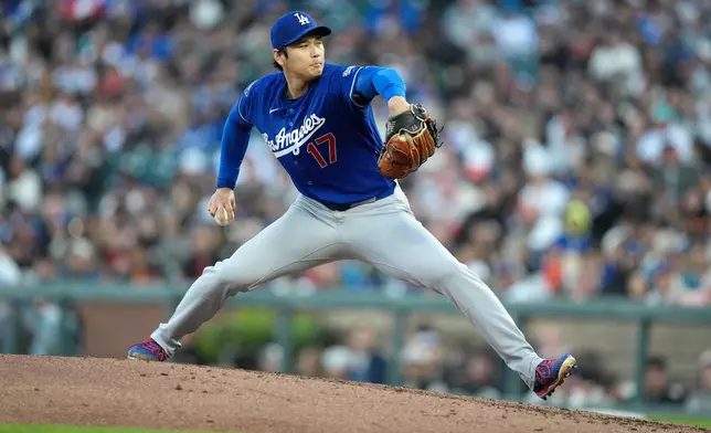 Los Angeles Dodgers pitcher Shohei Ohtani throws to a San Francisco Giants batter during the third inning of a baseball game Wednesday, April 22, 2026, in San Francisco. (AP Photo/Tony Avelar)