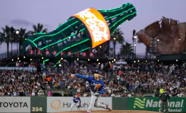Los Angeles Dodgers pitcher Shohei Ohtani throws to a San Francisco Giants batter during the fifth inning of a baseball game Wednesday, April 22, 2026, in San Francisco. (AP Photo/Tony Avelar)