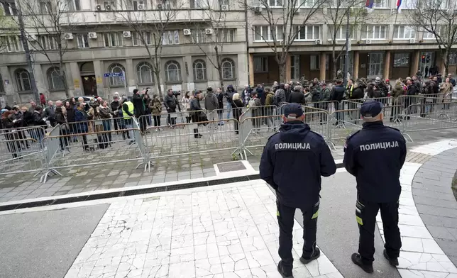 Serbian journalists block the traffic outside the offices of Serbia's President Aleksandar Vucic in Belgrade, Serbia, Wednesday, April 1, 2026, in protest of mounting attacks and pressure on the media. (AP Photo/Darko Vojinovic)