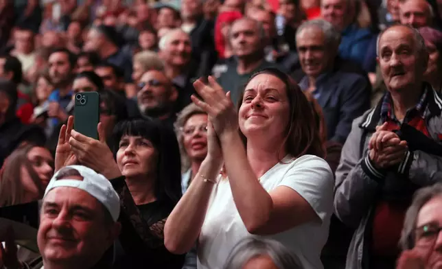 A supporter of former Bulgarian President Rumen Radev reacts during the closing rally of his campaign, in Sofia, Thursday, April 16, 2026, as Bulgaria heads into an early parliamentary election. (AP Photo/Valentina Petrova)