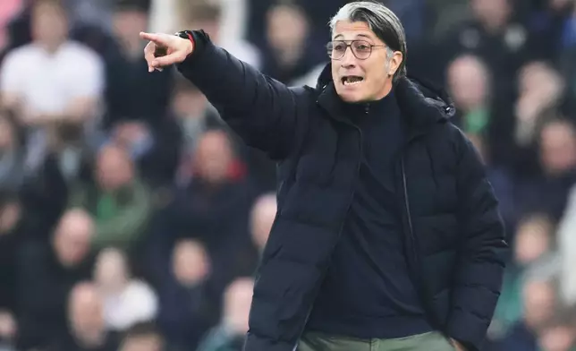 FILE - Switzerland's coach Murat Yakin gives instructions to his players during the international friendly soccer match between Northern Ireland and Switzerland at Windsor Park stadium, in Belfast, Northern Ireland, Friday, March 21, 2025. (AP Photo/Peter Morrison, File)