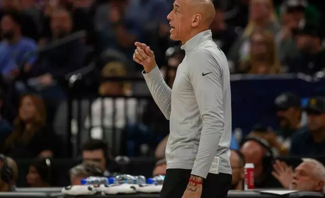 Sacramento Kings head coach Doug Christie shouts instructions from the bench during the first half of an NBA basketball game against the Los Angeles Clippers in Sacramento, Calif., Sunday, April 5, 2026. (AP Photo/Randall Benton)