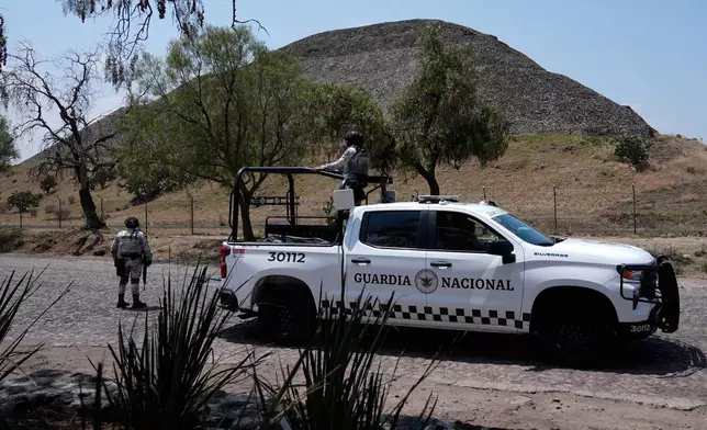 National Guard troops patrol the Teotihuacan pyramids, which remained closed a day after a gunman opened fire on tourists at the archaeological site outside Mexico City, Tuesday, April 21, 2026. (AP Photo/Marco Ugarte)