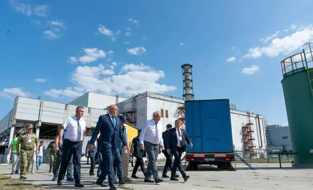 FILE - In this photo released by Rosatom State Atomic Energy Corporation, International Atomic Energy Agency Director General Rafael Grossi, center, walks with members of his delegation and employees while visiting the Kursk Nuclear Power Plant outside the town of Kurchatov, Russia, on Aug. 27, 2024. (Rosatom State Atomic Energy Corporation via AP, File)