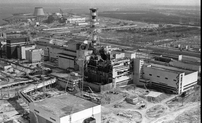 FILE - The Chernobyl nuclear plant is seen in an aerial view, showing the damage from an explosion and fire on April 26, 1986, that sent a radioactive plume over Europe. (AP Photo/ Volodymyr Repik, File)