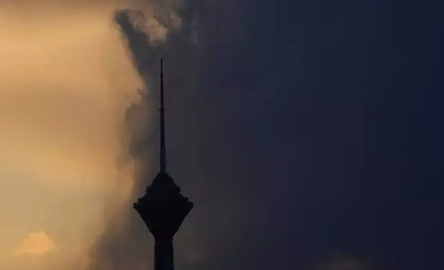 Milad telecommunication tower is seen during a cloudy sunset in Tehran, Iran, Sunday, April 5, 2026. (AP Photo/Vahid Salemi)