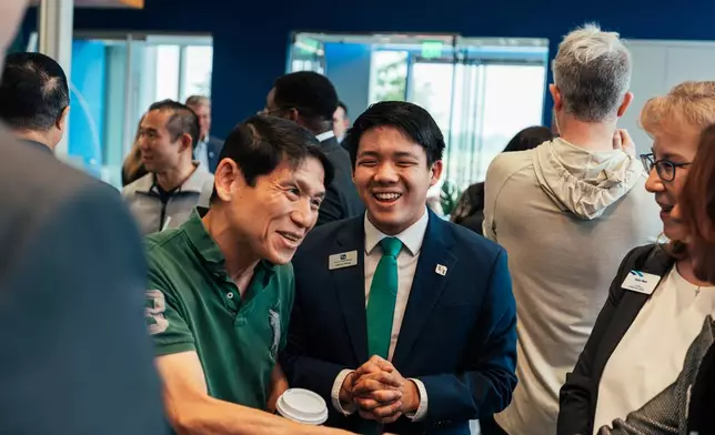 Gabriel Wang, Fifth Third Financial Center Manager, celebrates with the crowd at the opening of Fifth Third's first Texas branch.