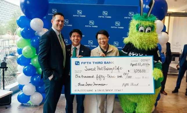 Brian Enzler, Fifth Third North Texas Region President, Gabriel Wang, Fifth Third Financial Center Manager present a donation to Kuang Zhang, owner of Sweet Hut Bakery &amp; Cafe.