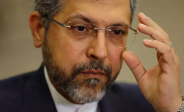 Iran's Deputy Foreign Minister Saeed Khatibzadeh adjusts his glasses as he talks during an interview with Associated Press at the Antalya Diplomacy Forum, in Antalya, southern Turkey, Saturday, April 18, 2026. (AP Photo/Riza Ozel)