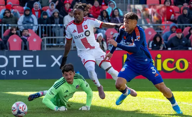 Toronto FC midfielder Malik Henry (78) and FC Cincinnati defender Gilberto Flores (3) chase as the ball as it gets past FC Cincinnati goalkeeper Roman Celentano (18) for a goal during the second half of an MLS soccer game in Toronto, Saturday, April 11, 2026. (Frank Gunn/The Canadian Press via AP)