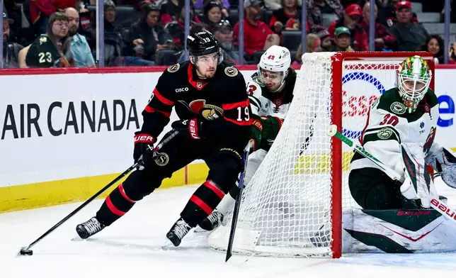 Ottawa Senators' Drake Batherson (19) is chased down by Minnesota Wild's Quinn Hughes (43) during the second period of an NHL hockey game, Saturday, April 4, 2026, in Ottawa, Ontario. (Spencer Colby/The Canadian Press via AP)