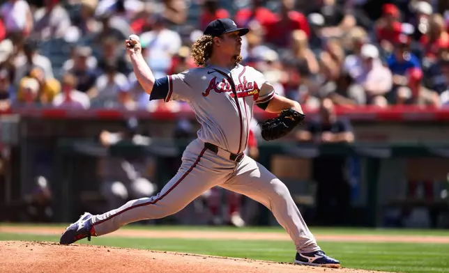Atlanta Braves pitcher Grant Holmes delivers during the first inning of a baseball game against the Los Angeles Angels, Wednesday, April 8, 2026, in Anaheim, Calif. (AP Photo/William Liang)
