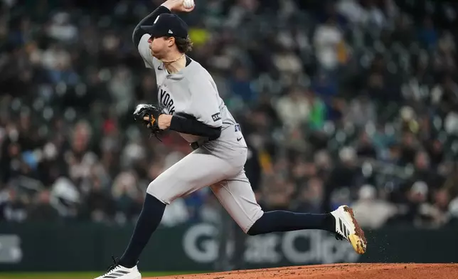 New York Yankees starting pitcher Cam Schlittler throws against the Seattle Mariners during the third inning of a baseball game, Wednesday, April 1, 2026, in Seattle. (AP Photo/Lindsey Wasson)