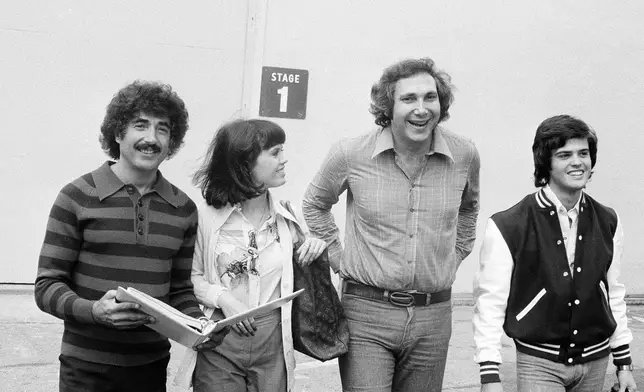 FILE - Sid Krofft, left, and his brother Marty Krofft, second from right, pose with Marie Osmond and Donnie Osmond on the set of "The Donnie and Marie Show" in Los Angeles on Oct. 6, 1976. (AP Photo/David F. Smith, File)