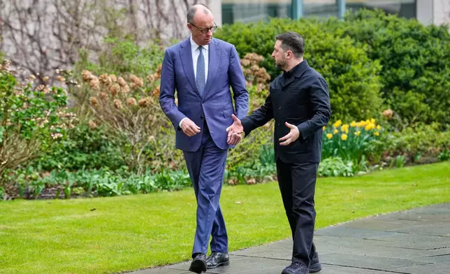 German chancellor Friedrich Merz welcomes Ukraine's President Volodymyr Zelenskyy for German-Ukrainian government consultations in Berlin Germany, Tuesday, April 14, 2026. (AP Photo/Ebrahim Noroozi)