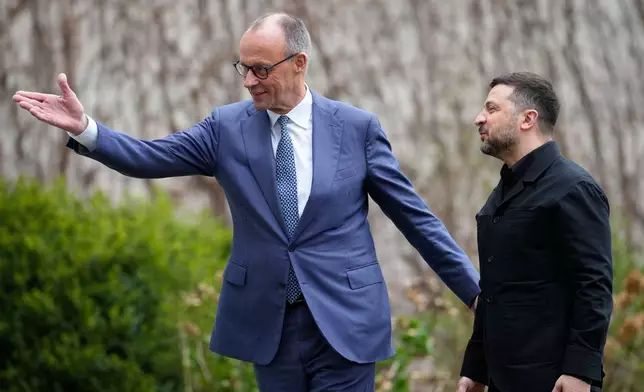 German chancellor Friedrich Merz welcomes Ukraine's President Volodymyr Zelenskyy for German-Ukrainian government consultations in Berlin Germany, Tuesday, April 14, 2026. (AP Photo/Ebrahim Noroozi)
