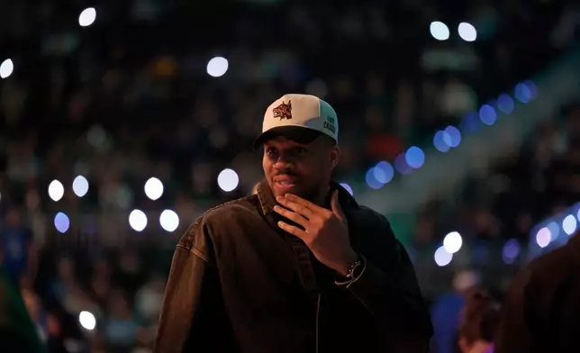 Milwaukee Bucks forward Giannis Antetokounmpo looks on during player introductions before an NBA basketball game against the Dallas Mavericks, Tuesday, March 31, 2026, in Milwaukee. (AP Photo/Jeffrey Phelps)