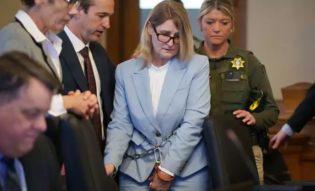 Kristin Ramsey, charged in the killing of a young real estate agent, enters a hearing at the Dallas County courthouse, Friday, April 10, 2026 in Adel, Iowa. (Zach Boyden-Holmes/The Des Moines Register via AP, Pool)