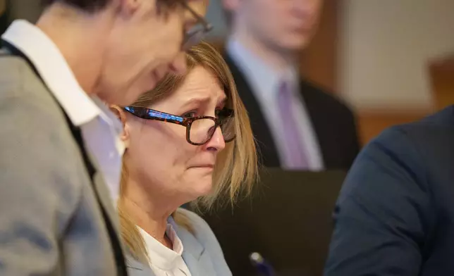 Kristin Ramsey, charged in the killing of a young real estate agent, sits in a hearing at the Dallas County courthouse, Friday, April 10, 2026 in Adel, Iowa. (Zach Boyden-Holmes/The Des Moines Register via AP, Pool)