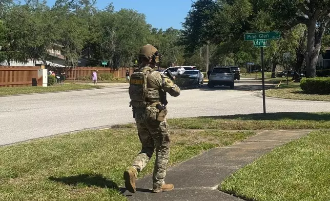 The Hillsborough County Sheriff's Office responds to a neighborhood close to the University of South Florida campus, on Friday, April 24, 2026 in Tampa, Fla. (Hillsborough County Sheriff's Office via AP)