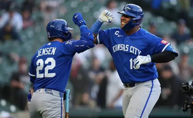 Kansas City Royals catcher Salvador Perez, right, celebrates his three-run home run with Carter Jensen (22) against the Detroit Tigers during the seventh inning of a baseball game Thursday, April 16, 2026, in Detroit. (AP Photo/Paul Sancya)