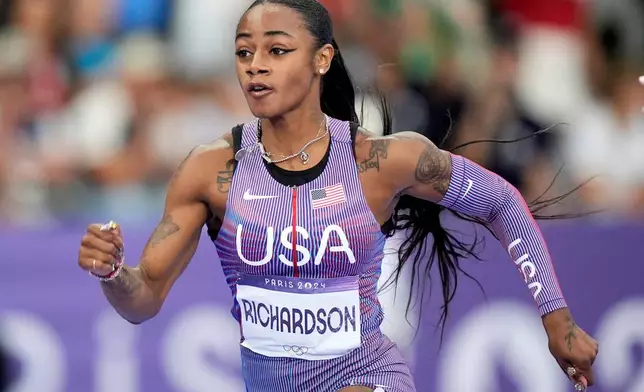 FILE - Sha'carri Richardson, of the United States, competes in the women's 100-meter semifinals at the 2024 Summer Olympics, on Aug. 3, 2024, in Saint-Denis, France. (AP Photo/Matthias Schrader, File)