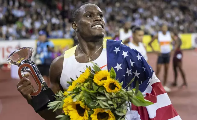 FILE - Christian Coleman of United States celebrates winning the men's 100m competition during the World Athletics Diamond League final 2025 athletics meeting in Zurich, Switzerland, Thursday, Aug. 28, 2025. (Michael Buholzer/Keystone via AP, File)