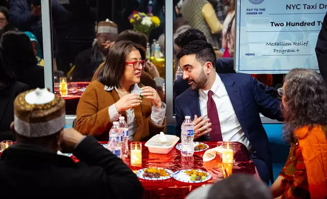 FILE - New York City Mayor Zohran Mamdani speaks with Midori Valdivia, Chair of Taxi and Limousine Commission, at a Ramadan Iftar hosted by his team at the New York Taxi Workers Association, March 18, 2026, in New York. (AP Photo/Angelina Katsanis, File)