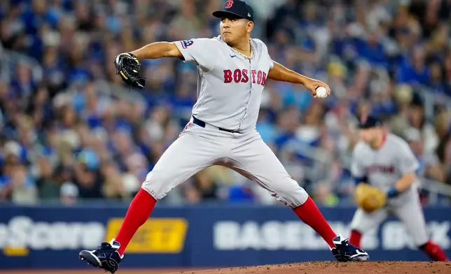 Boston Red Sox pitcher Ranger Suarez works against the Toronto Blue Jays during first-inning baseball game action in Toronto, Monday, April 27, 2026. (Frank Gunn/The Canadian Press via AP)