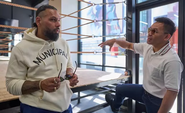 Jas Mathur, CEO of Manny Pacquiao Promotions, left, and boxer Manny Pacquiao tour the new "Pacquiao Prime Boxing" gym, a boxing facility formerly owned by rival Floyd Mayweather Jr., in the Hollywood area of Los Angeles on Monday, April 6, 2026. (AP Photo/Damian Dovarganes)