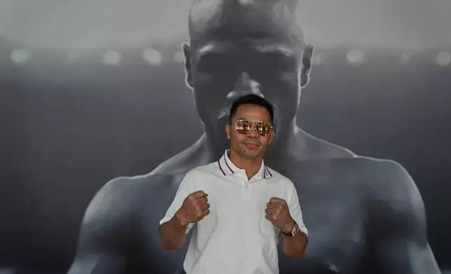 Boxer Manny Pacquiao poses fora pictures while touringfff "Pacquiao Prime Boxing," his newly acquired gym in Hollywood, on Monday, April 6, 2026. The facility was formerly owned by rival Floyd Mayweather Jr. (AP Photo/Damian Dovarganes)