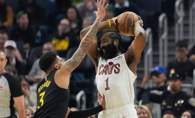 Cleveland Cavaliers guard James Harden (1) looks to pass the ball while being defended by Golden State Warriors guard Will Richard during the first half of an NBA basketball game in San Francisco, Thursday, April 2, 2026. (AP Photo/Jeff Chiu)