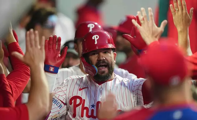 Philadelphia Phillies' Kyle Schwarber celebrates after his two-run home run off Chicago Cubs pitcher Javier Assad during the third inning of a baseball game, Monday, April 13, 2026, in Philadelphia. (AP Photo/Matt Rourke)