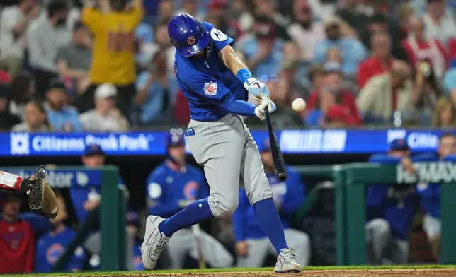 Chicago Cubs' Dansby Swanson hits a two-run home run off Philadelphia Phillies pitcher Cristopher Sánchez during the fourth inning of a baseball game, Monday, April 13, 2026, in Philadelphia. (AP Photo/Matt Rourke)